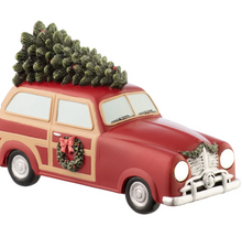 Load image into Gallery viewer, Decorative model of a vintage car with a Christmas tree on top, featuring a wreath and bow on the front.
